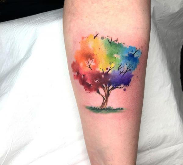 Watercolor tree tattoo on arm