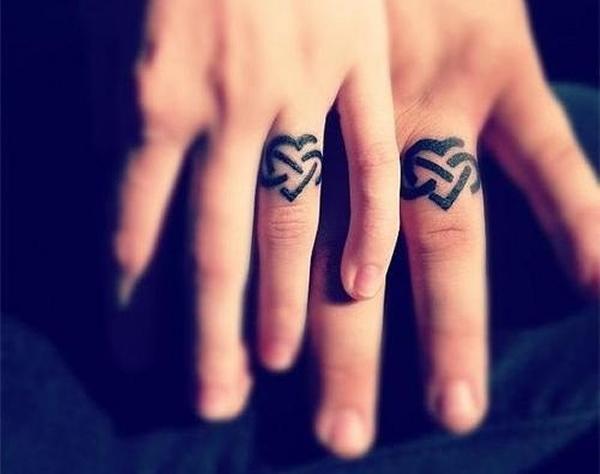 Infinity tattoo on the right ring finger