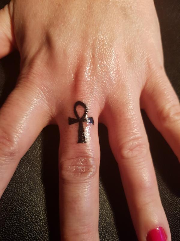 Ankh finger tattoo