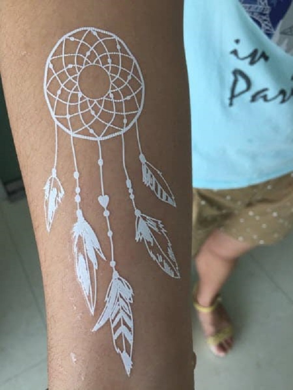 White Ink Dreamcatcher Tattoo On Dark Skin