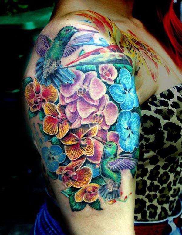 Hummingbird and flower half sleeve tattoo.