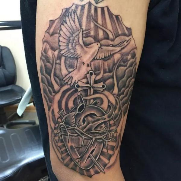 Barbed wire heart with cross and dove