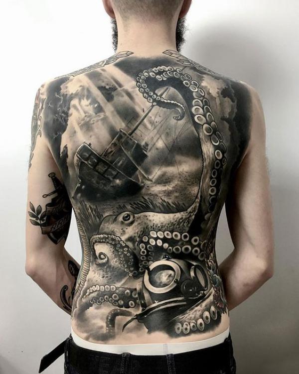 Black and grey octopus ship and scuba diver tattoo on full back