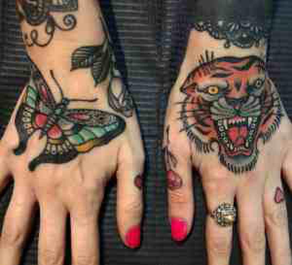 Butterfly and tiger head on two hands