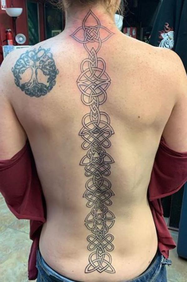 Celtic knot spine tattoo