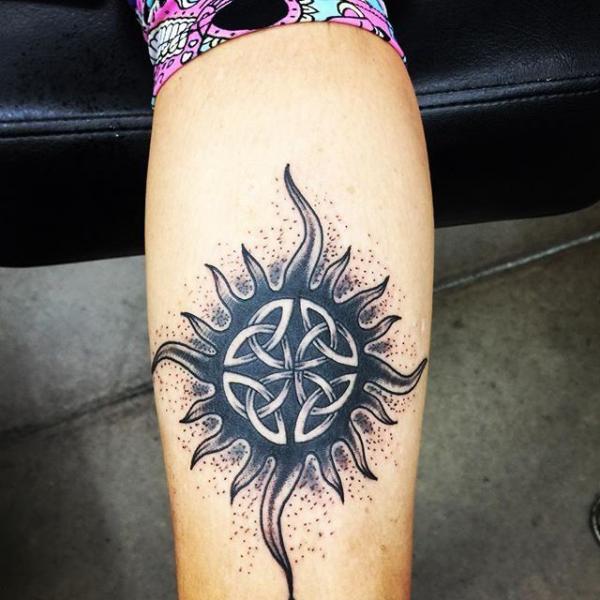 Celtic sun tattoo