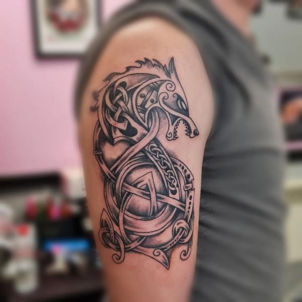 Celtic wolf half sleeve tattoo