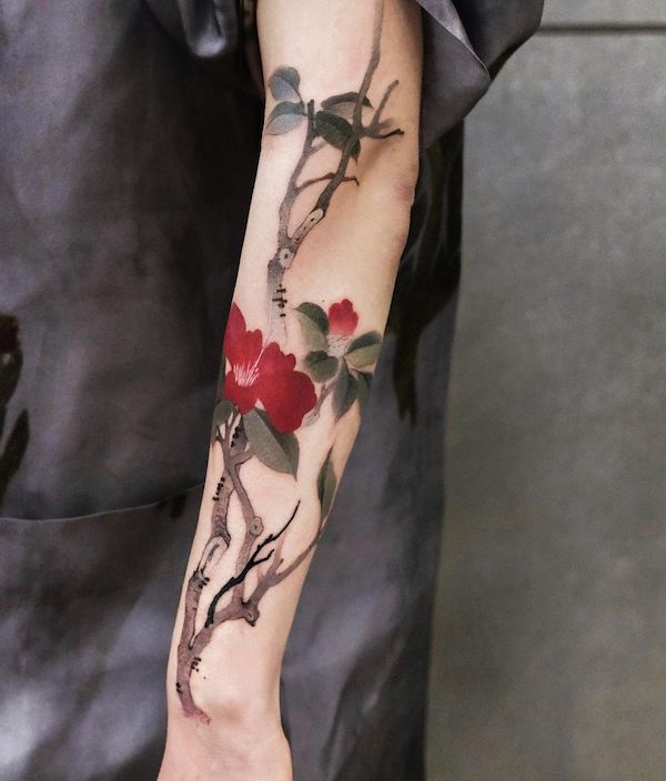 Forearm flower ink tattoo in Japanese style