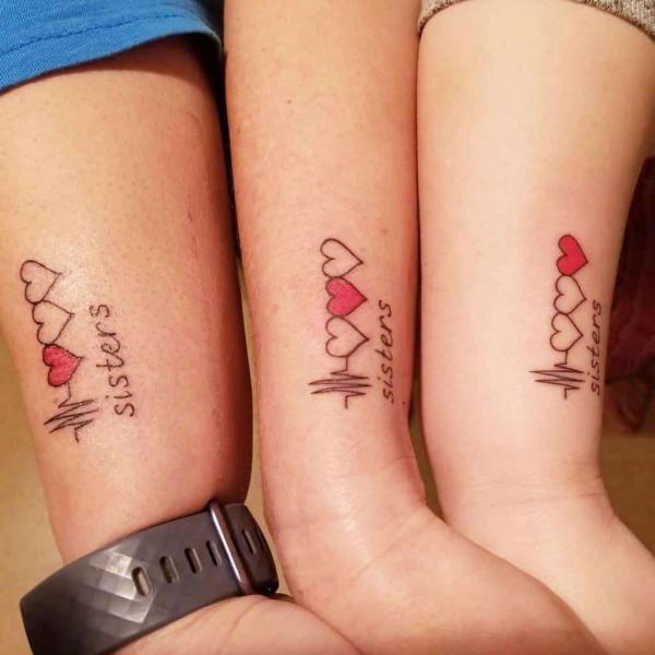 Hearts and lifeline sister tattoo