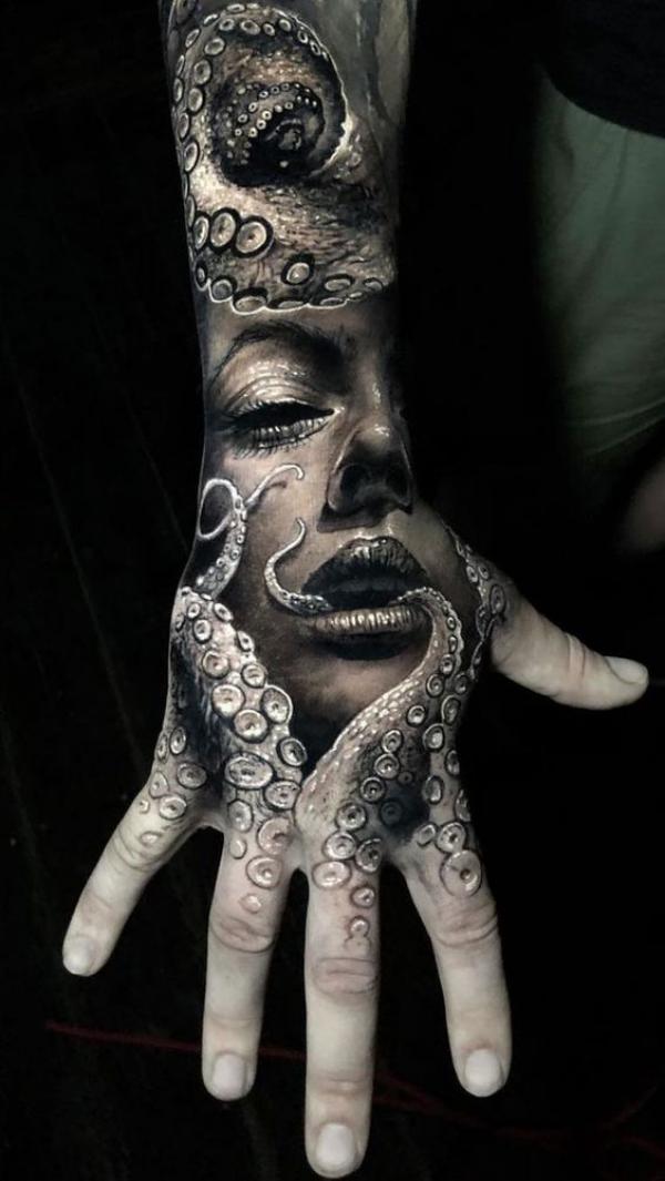 Lady face and octopus hand tattoo
