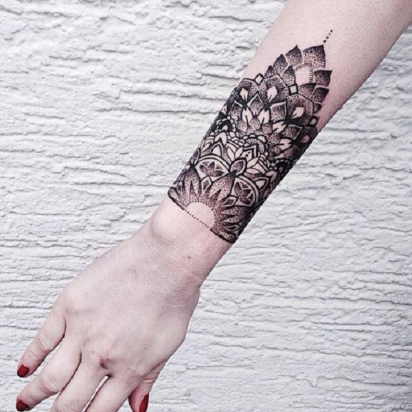 How Do Artists Design Tattoos That Extend From The Hand To The Forearm?