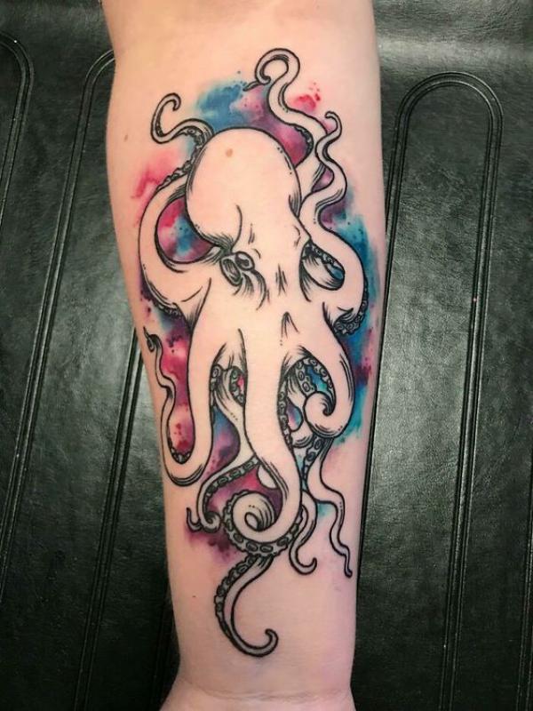 Negative space octopus tattoo on watercolor backdrop