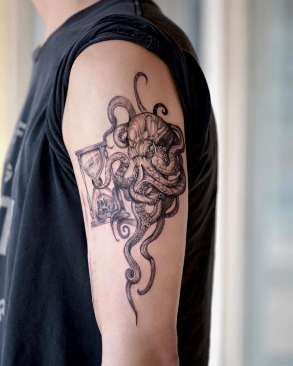 Octopus and hourglass tattoo