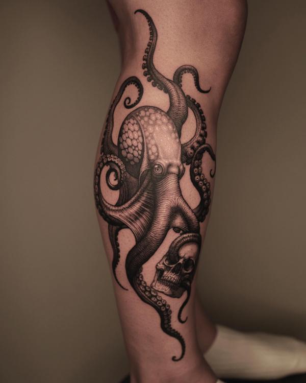 Octopus and skull lower leg tattoo