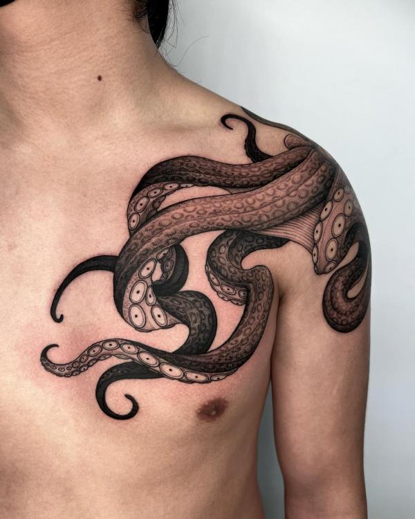 Octopus tentacles chest tattoo