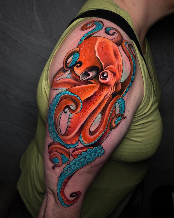 Orange and blue octopus half sleeve tattoo