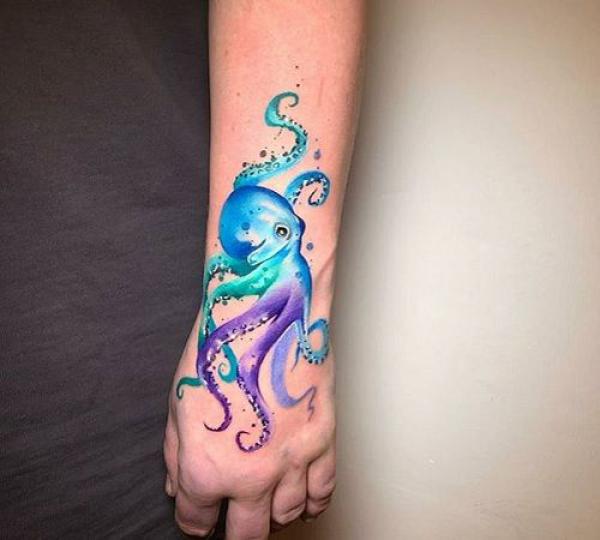 Purple and blue octopus wrist and hand tattoo