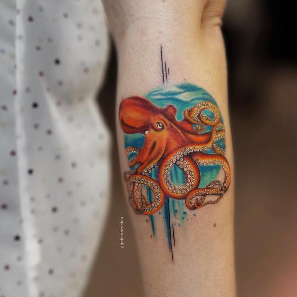 Realistic octopus and ocean tattoo