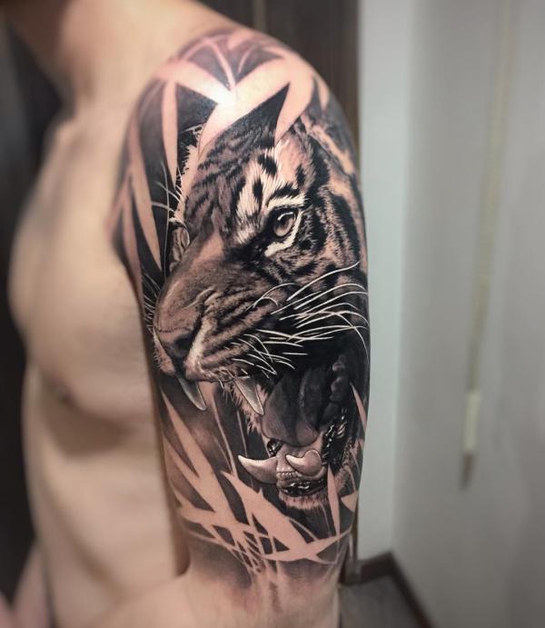 Roaring tiger head with negative space leaves