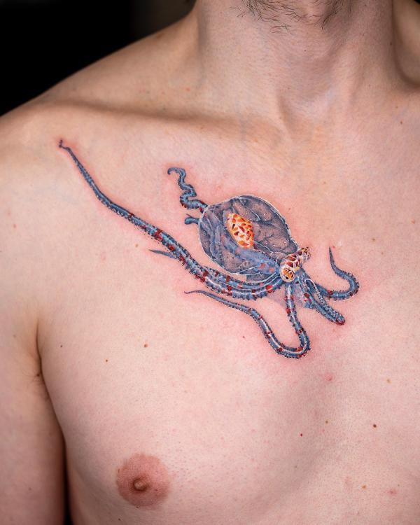 Small octopus chest tattoo