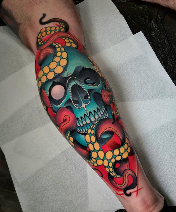 Traditional octopus skull calf tattoo