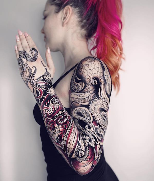 Tattooed woman with octopus full sleeve tattoo