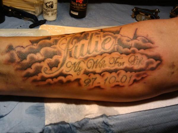 7. "Bold Forearm Tattoos with Clouds" - wide 2
