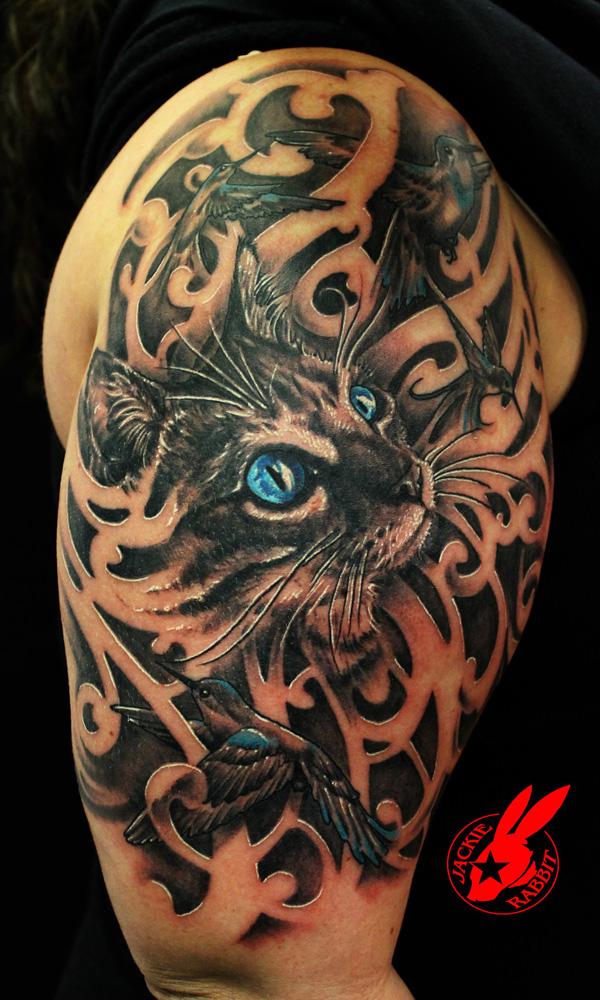 Realistic cat tattoo with roses and red eyes done by @chehomova_dasha in  Poland | www.otziapp.com | Cat eye tattoos, Cat tattoo, Sleeve tattoos