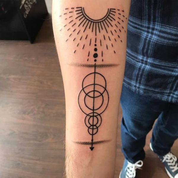 Half sun solar system line work tattoo