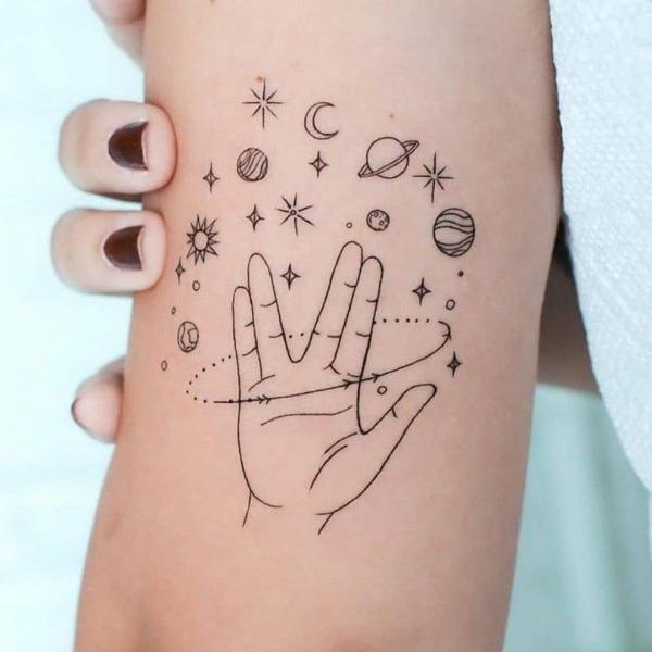 Hand and solar system tattoo