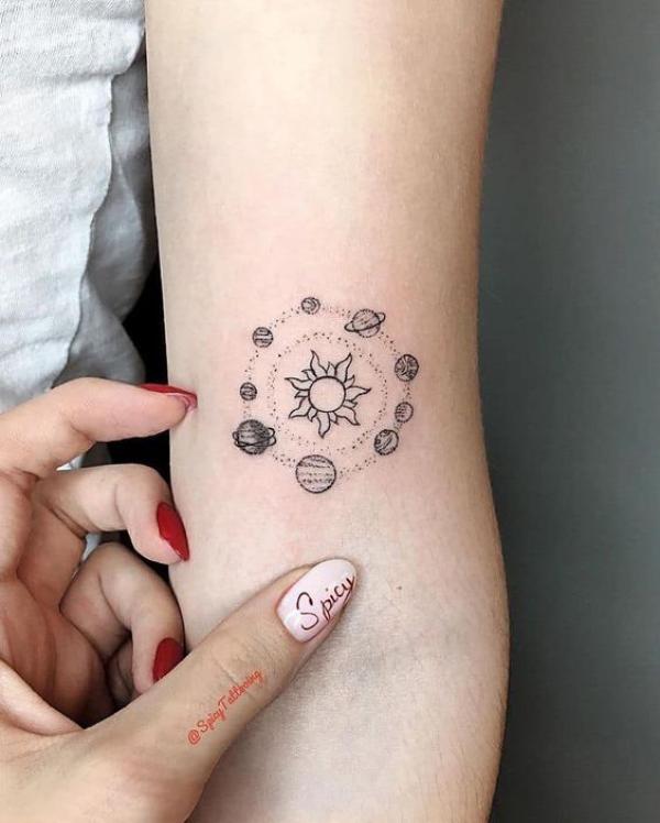 Small circular solar system tattoo