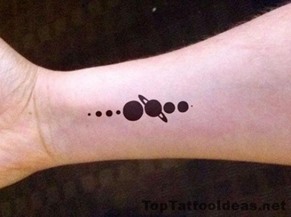 Small silhouette solar system tattoo