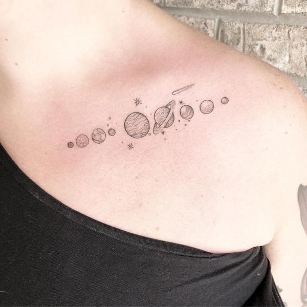 Solar system and shooting star tattoo