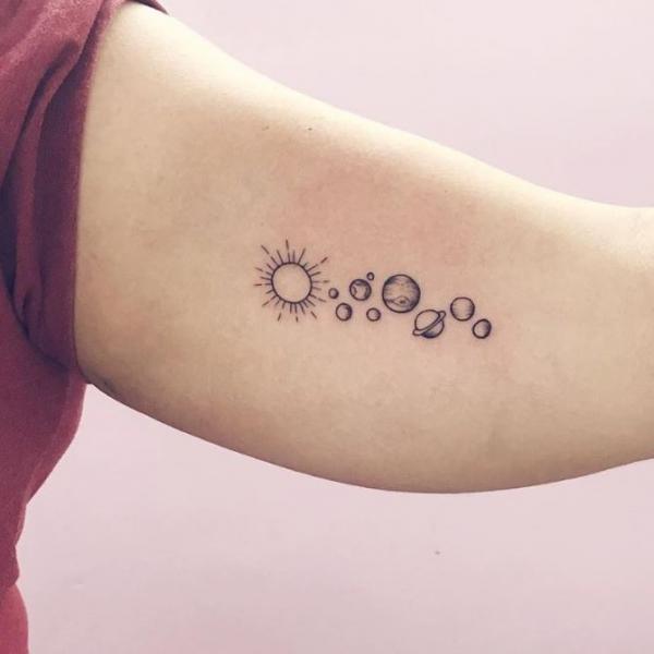 Sun and moon solar system Tattoo on bicep