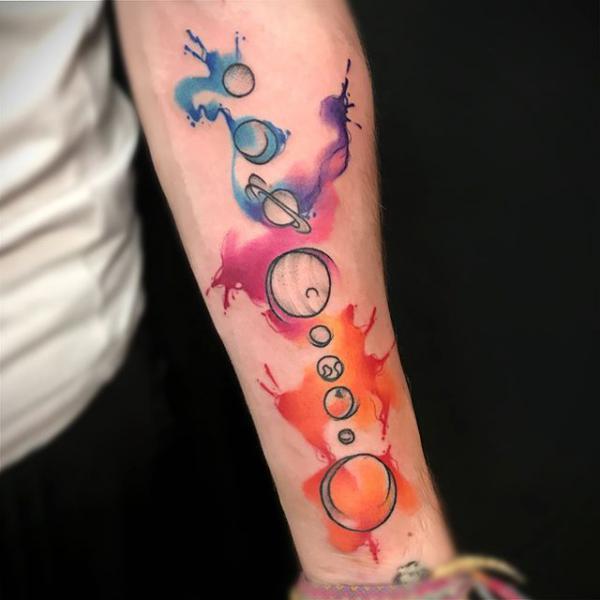 Watercolor solar system forearm tattoo