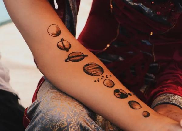 solar system henna tattoo on arm