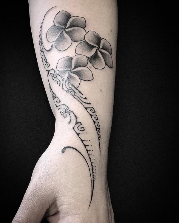 Tribal and flower wrist tattoo for women