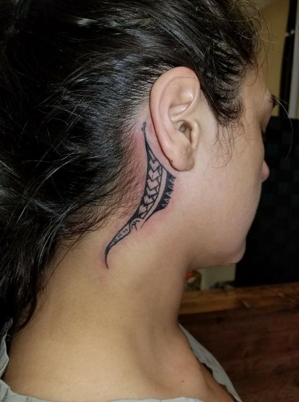 Tribal behind the ear tattoo