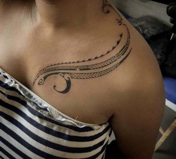 Tribal clavicle tattoo for women