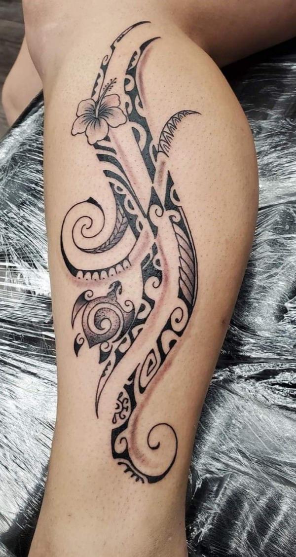Tribal floral lower leg tattoo for women