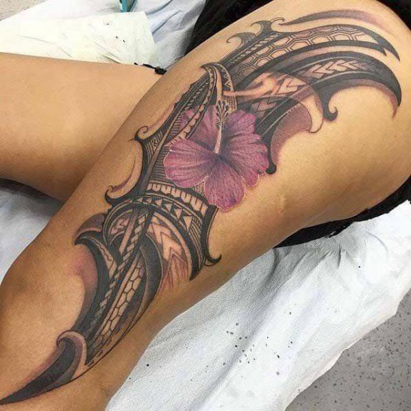 Tribal hibiscus flower thigh tattoo for women