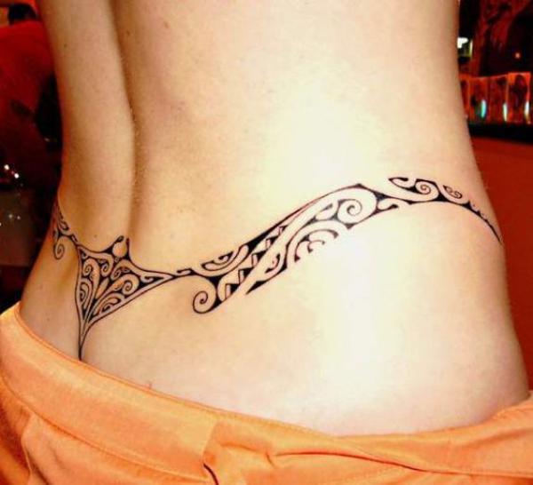 Tribal low back tattoo female