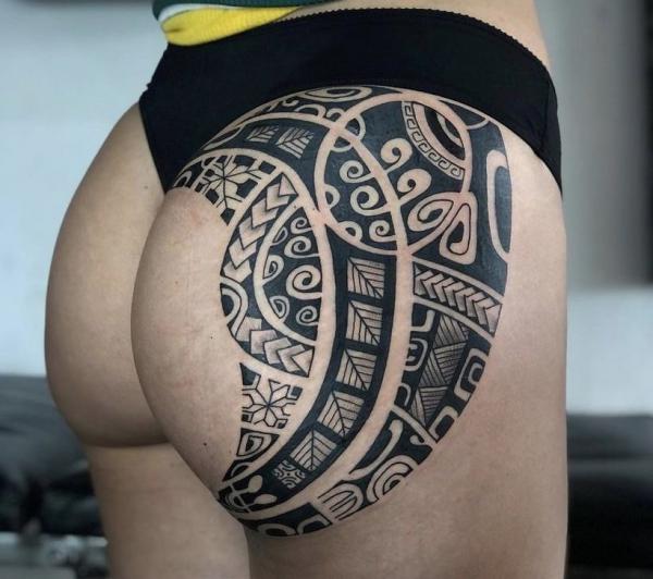 Tribal pattern hip tattoo for women