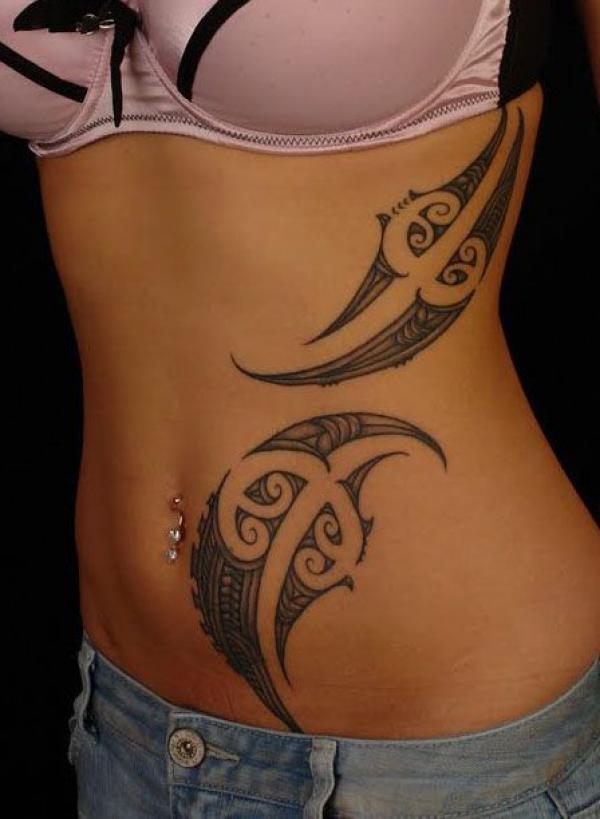 Tribal side tattoo for female