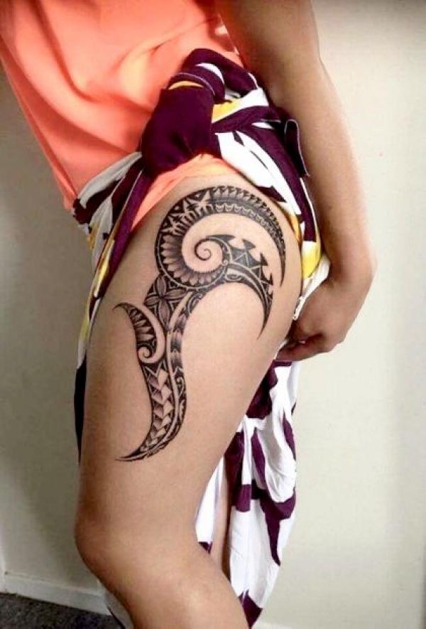 Tribal side thigh tattoo for women