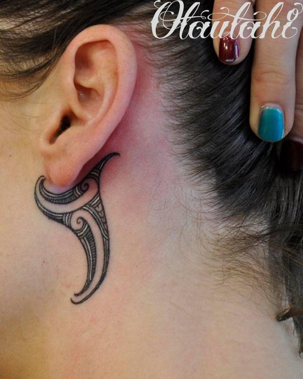 Tribal tattoo behind the ear