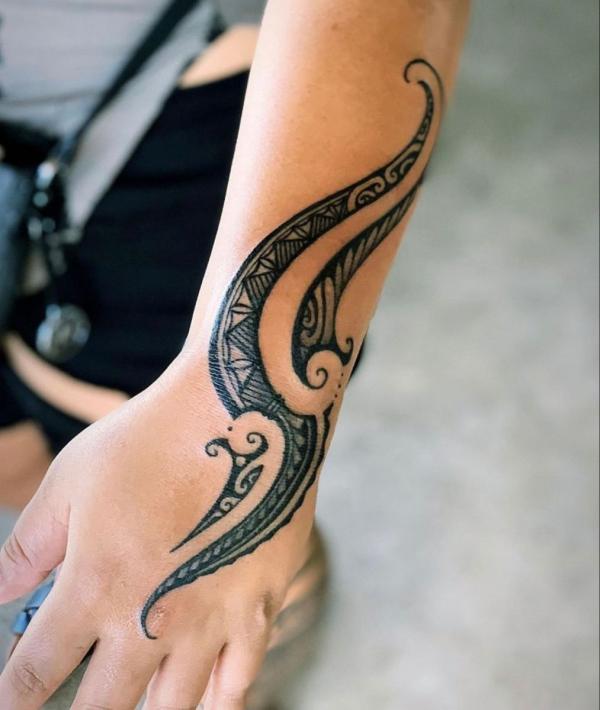 Tribal wrist tattoo for women