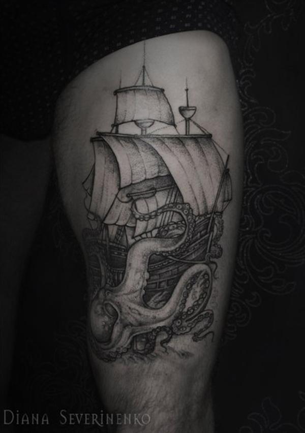 Sketchy boat and octopus tattoo on thigh