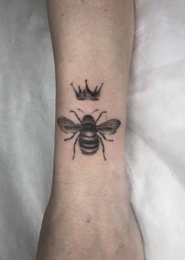 Black and grey queen crown and bee tattoo