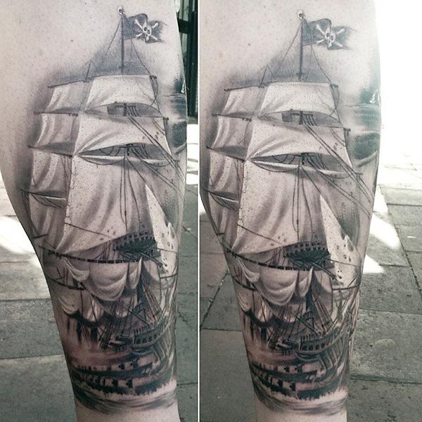 Sailboat calf tattoo for men